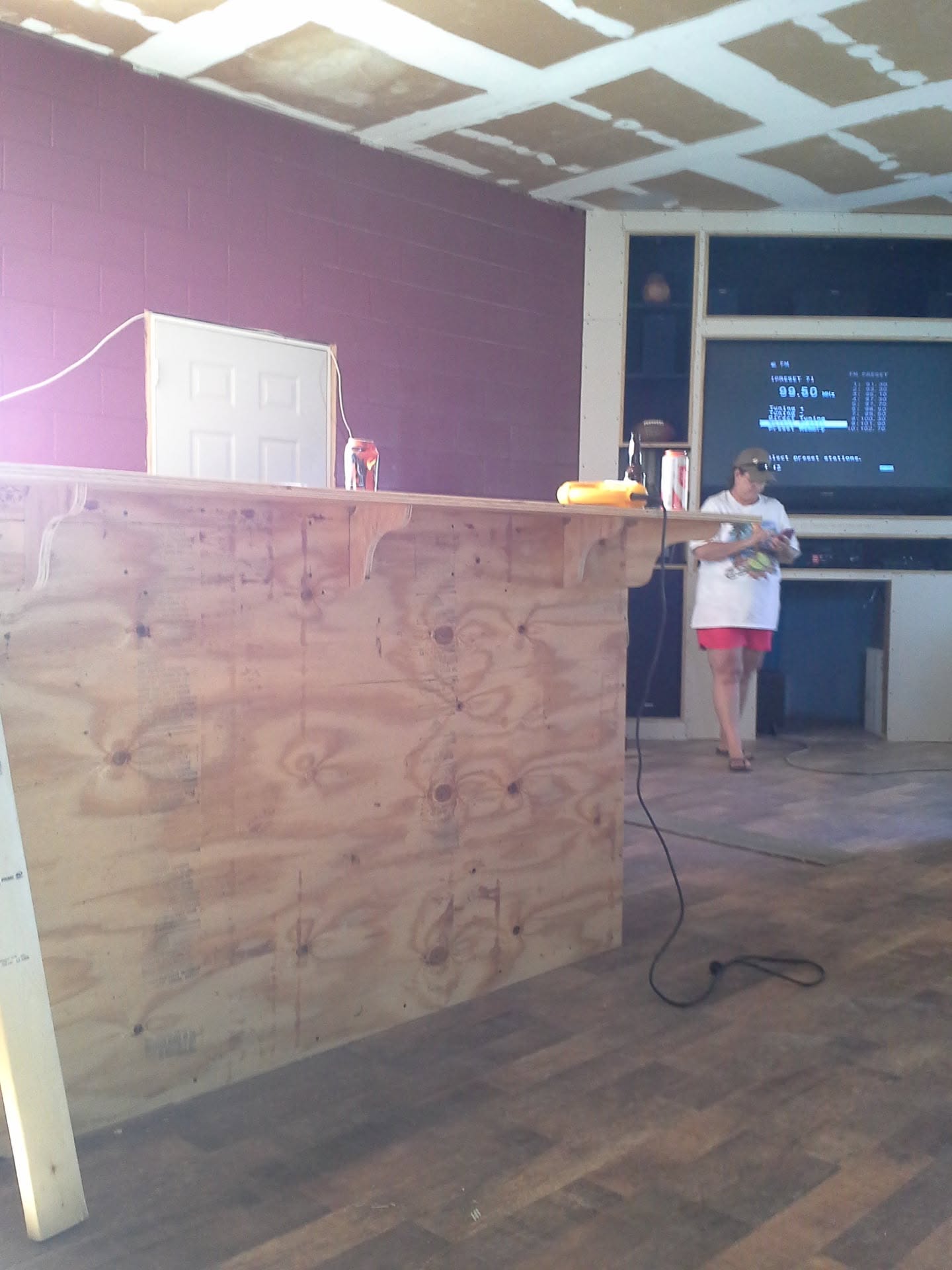 Wood-framed interior bar front and counter under construction