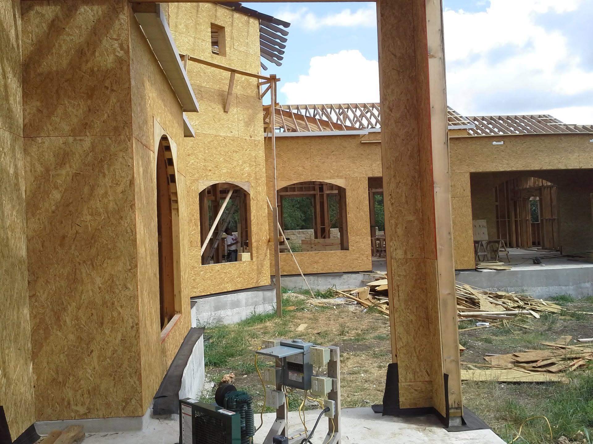Garage walls and roof framing with arched window openings